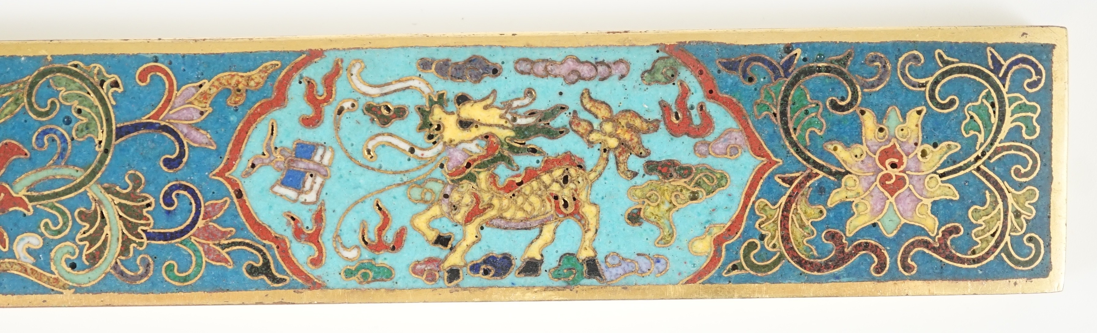 A Chinese cloisonné enamel and gilt bronze scroll weight, 24.8cm long